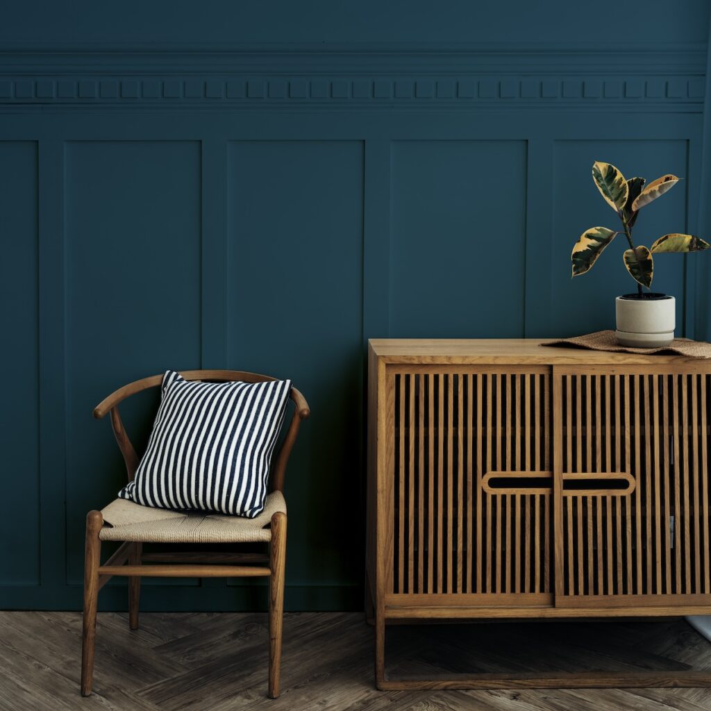 D Couvrez Les Tendances Du Mobilier Design En 2024 Comment Embellir   Scandinavian Vintage Wood Cabinet With Chair By Dark Blue Wall 1024x1024 